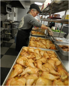 Our Staff Preparing One of Our Meals